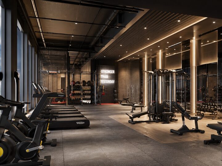 Cardio zone: a row of treadmills and bikes by panoramic windows